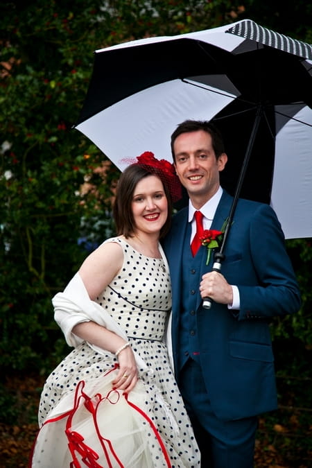 Bride and groom under umbrella - Picture by Anneli Marinovich Photography