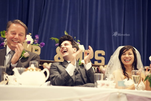 Groom laughing at wedding speech - Picture by Mirrorbox Photography