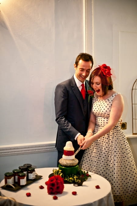 Bride and groom cutting wedding cheese stack - Picture by Anneli Marinovich Photography