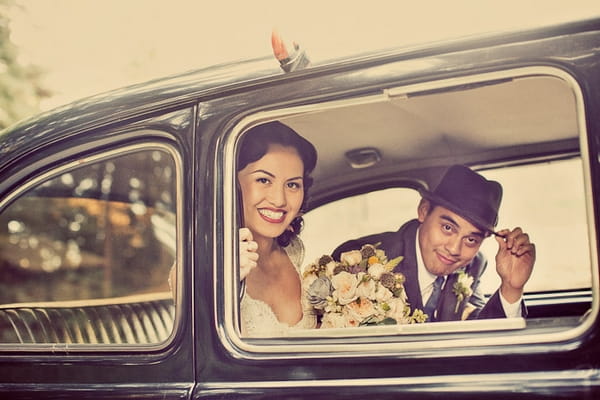 Vintage bride and groom in wedding car - Picture by Paco and Betty