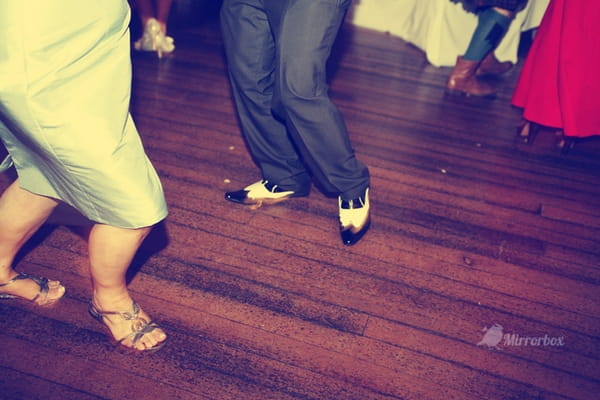 Legs of wedding guests dancing - Picture by Mirrorbox Photography