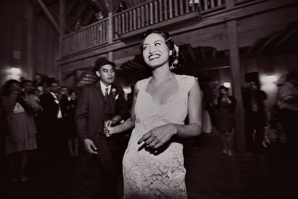 Bride leading groom to dance floor - Picture by Paco and Betty