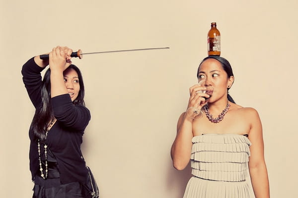 Wedding guests posing in funbooth with samurai sword - Picture by Paco and Betty