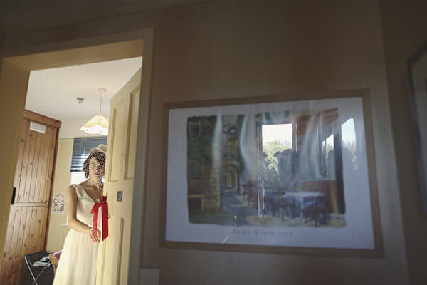 Picture of bride through door - Picture by York Place Studios