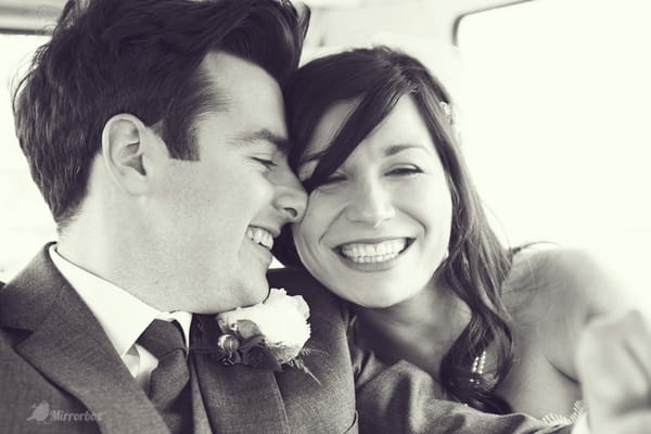 Bride and groom smiling - Picture by Mirrorbox Photography