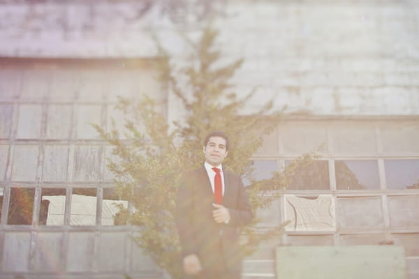 Groom standing in front of tree - Picture by Our Labor of Love Photography
