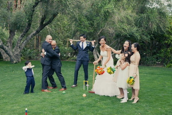 Wedding party playing croquet - Picture by onelove photography