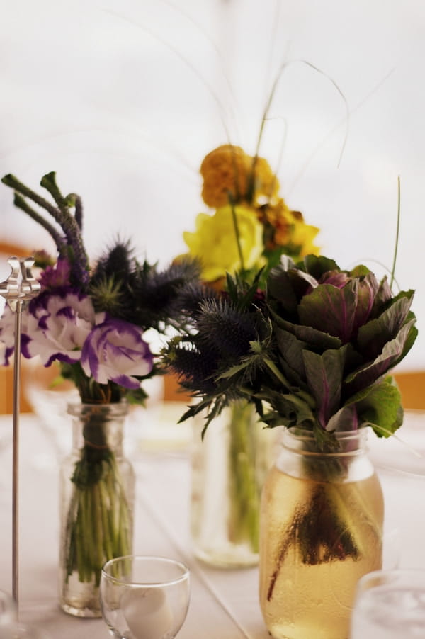 Wedding table flowers in jars - Picture by Judy Pak Photography