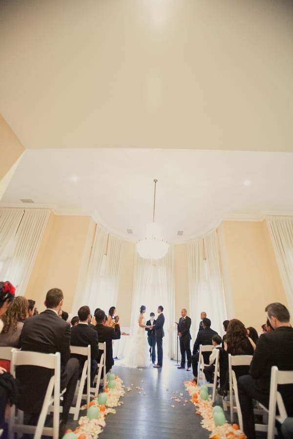 Looking down the aisle of wedding ceremony - Picture by onelove photography