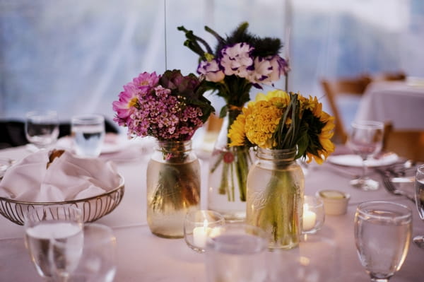 Wedding table flower centrepiece in jars - Picture by Judy Pak Photography