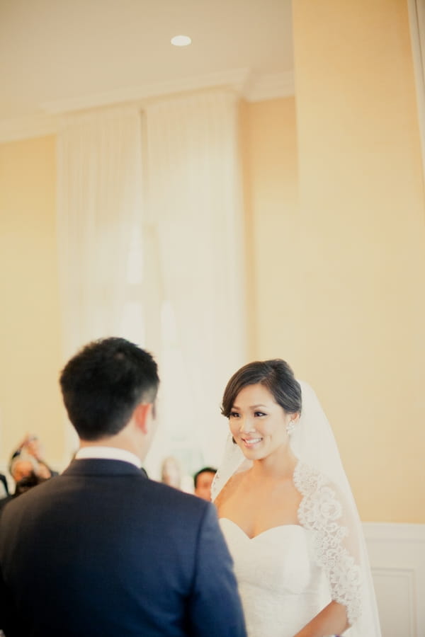 Bride looking at groom during wedding ceremony - Picture by onelove photography