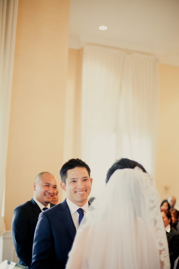 Groom looking at bride in wedding ceremony - Picture by onelove photography
