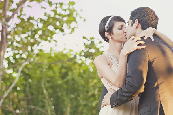 Bride and groom kissing - Picture by Our Labor of Love Photography