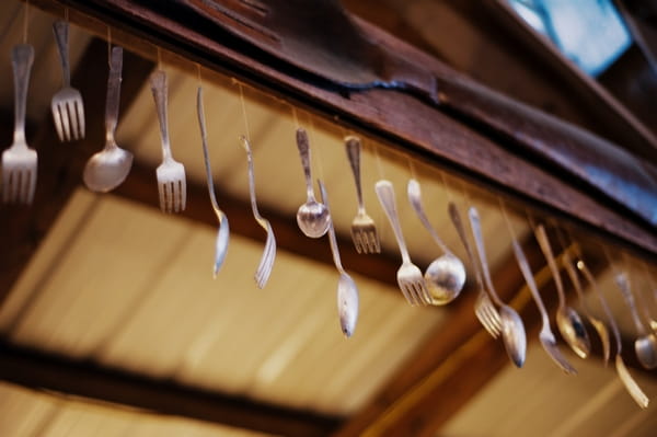 Cutlery hanging from beam - Picture by Judy Pak Photography