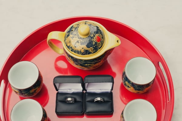 Wedding rings on tray with tea - Picture by onelove photography