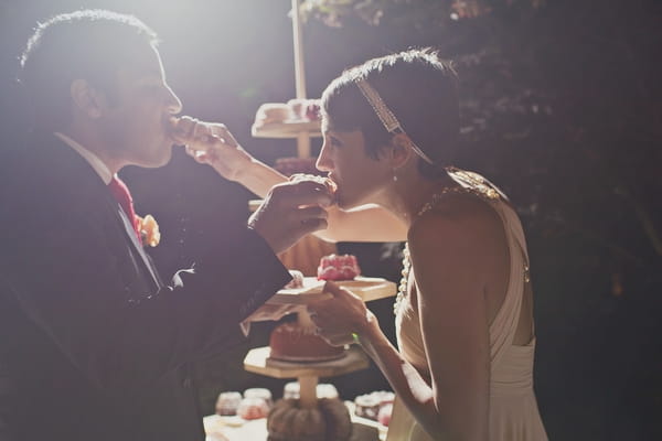 Bride and groom eating wedding cake - Picture by Our Labor of Love Photography