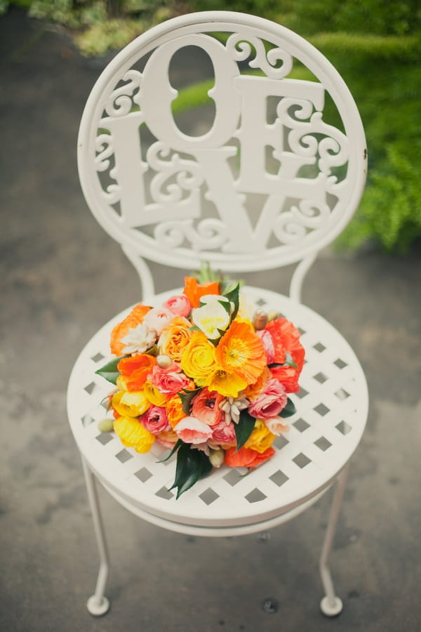 Bright wedding bouquet on chair - Picture by onelove photography