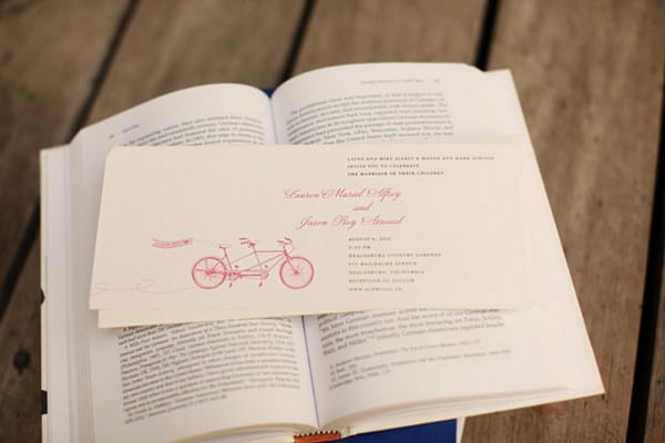 Wedding invitation on book - Picture by Kate Harrison Photography
