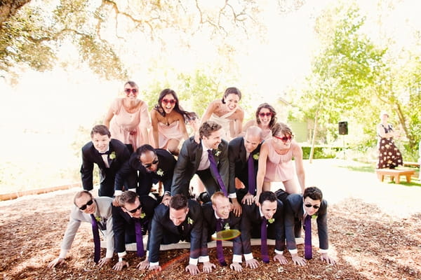 Bridal party in human pyramid - Picture by Kate Harrison Photography