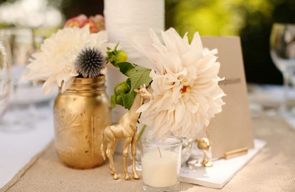 Wedding table with candle, flowers and gold vase - Picture by Kate Harrison Photography