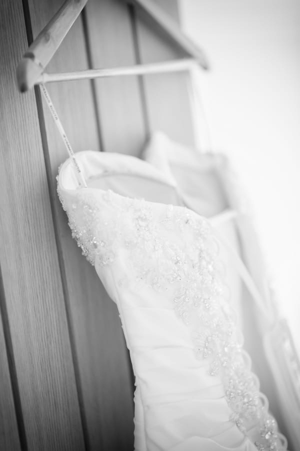 Wedding dress on hanger - Picture by Pixies in the Cellar