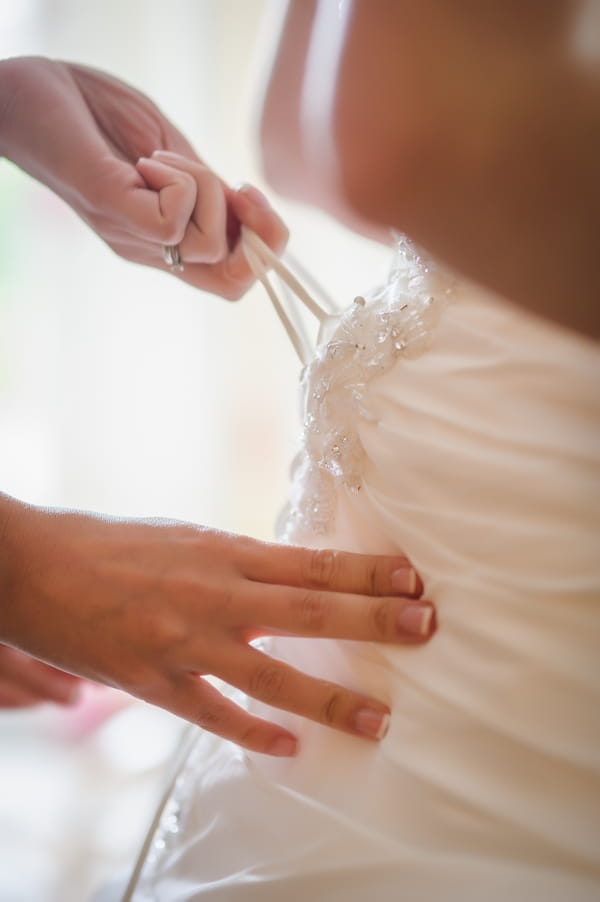 Hands tightening wedding dresss - Picture by Pixies in the Cellar