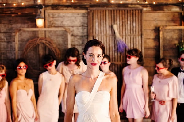 Bride and bridesmaids in barn - Picture by Kate Harrison Photography