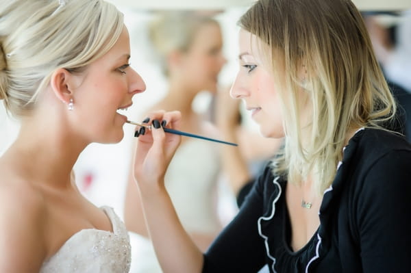 Bride having lipgloss applied - Picture by Pixies in the Cellar