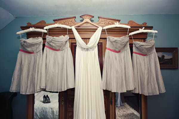 Wedding and bridesmaid dresses hanging on wardrobe - A Homemade Marquee Wedding