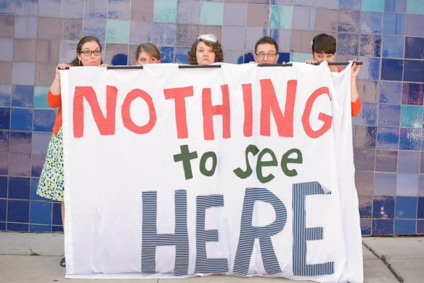 Wedding party holding up sign saying Nothing to see here - A Fun, Fun, Fun Wedding