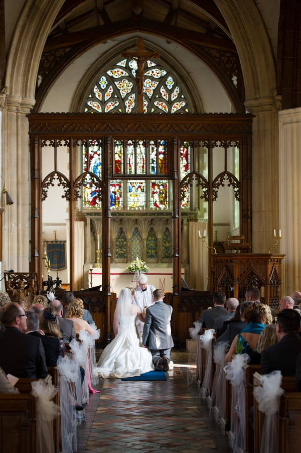 Bride and groom kneeling - Picture by Gareth Squance Photography