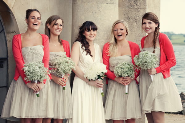 Bride posing with bridesmaids - A Homemade Marquee Wedding