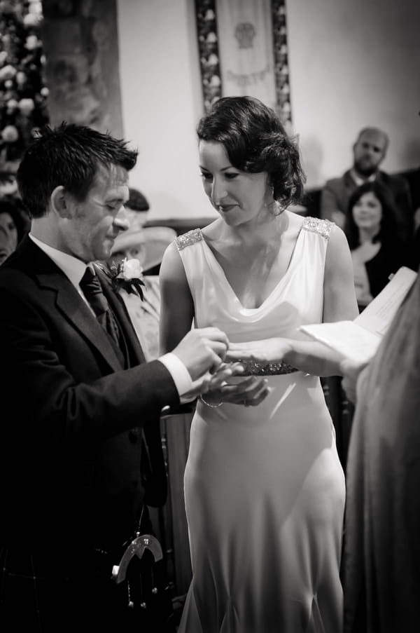 Bride and groom exchanging wedding rings - Picture by Jonathan Bean Photography