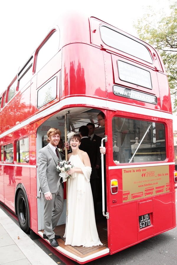 Bride and groom on back of red London bus - Picture by Rebecca Prigmore Photography