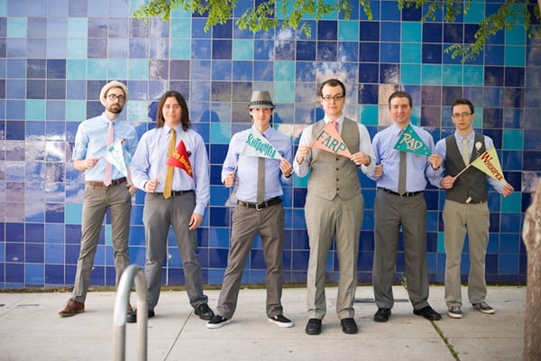 Groom and groomsmen holding flags - A Fun, Fun, Fun Wedding