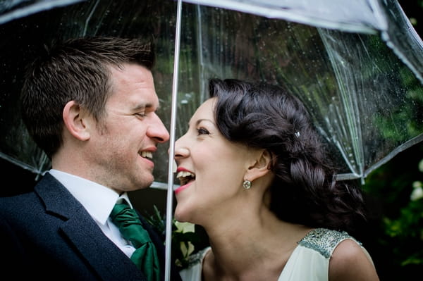 Bride and groom under umbrella - Picture by Jonathan Bean Photography