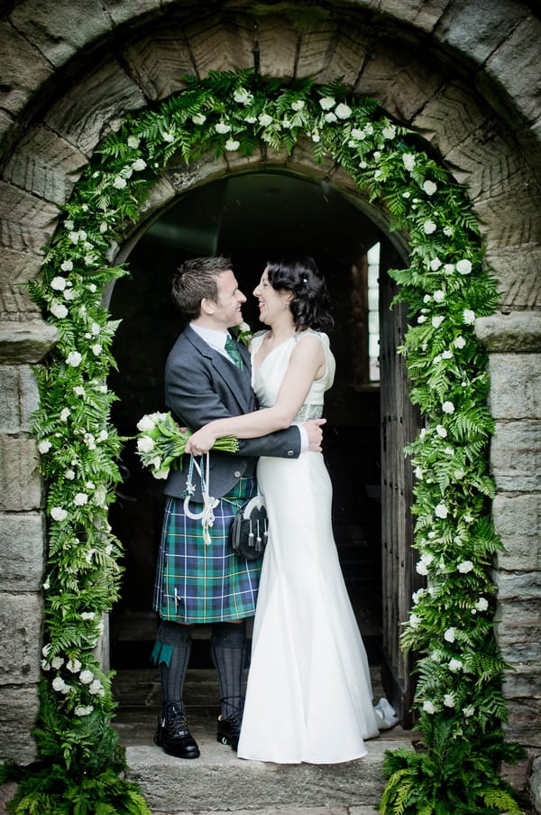 Bride and groom in church doorway - Picture by Jonathan Bean Photography
