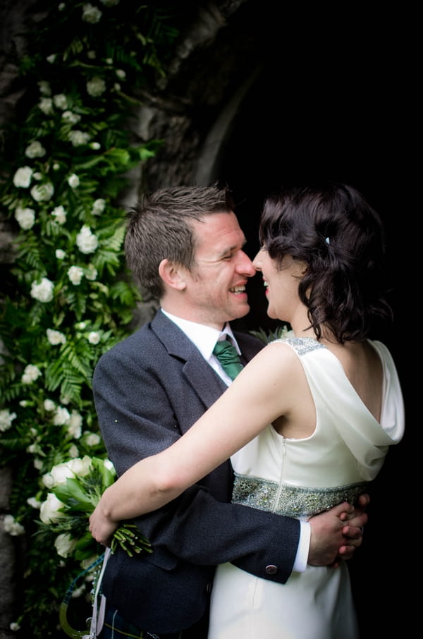 Bride and groom with arms around each other - Picture by Jonathan Bean Photography