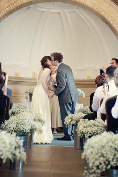 Bride and groom kiss in wedding ceremony - A Homemade Marquee Wedding