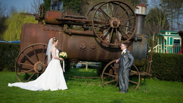 Bride and groom by old farm machinery - Picture by Gareth Squance Photography