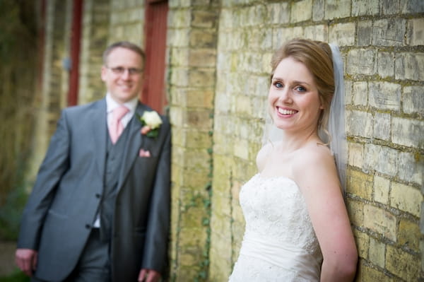 Bride and groom leaning against wall - Picture by Gareth Squance Photography