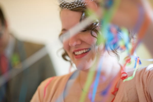 Bride untangling streamers - A Fun, Fun, Fun Wedding