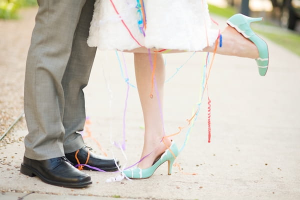 Bride lifting leg during kiss - A Fun, Fun, Fun Wedding