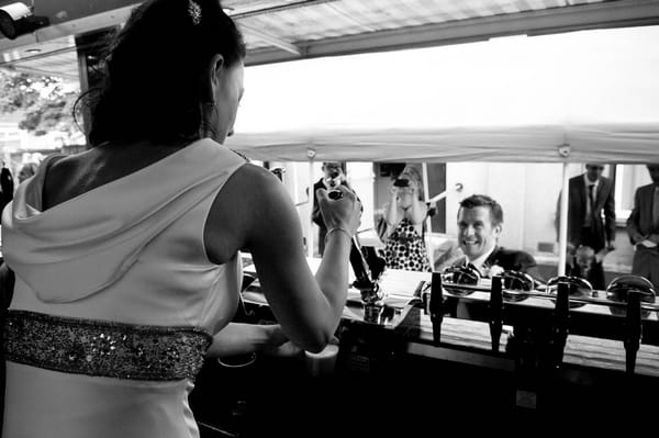 Bride pulling pint - Picture by Jonathan Bean Photography