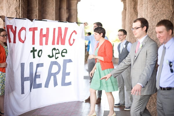 Wedding guests with Nothing to see here banner - A Fun, Fun, Fun Wedding