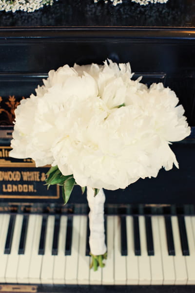 Bridal bouquet on piano - A Homemade Marquee Wedding