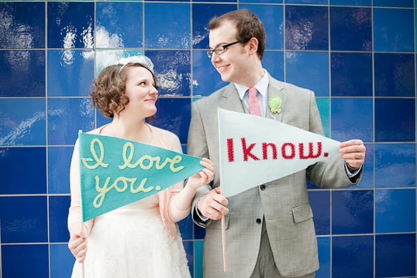 Bride and groom holding I love you flags - A Fun, Fun, Fun Wedding