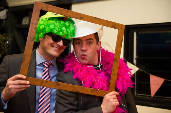 Wedding guests playing with dressing up props - Picture by Gareth Squance Photography