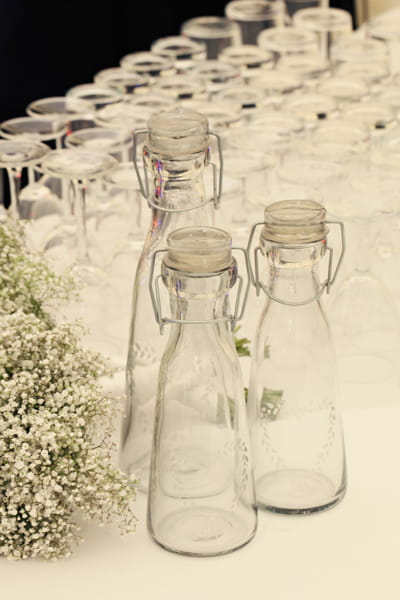 Empty glass bottles - A Homemade Marquee Wedding