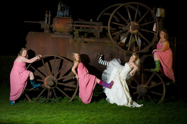 Bride and bridesmaids posing on olf farm machine - Picture by Gareth Squance Photography